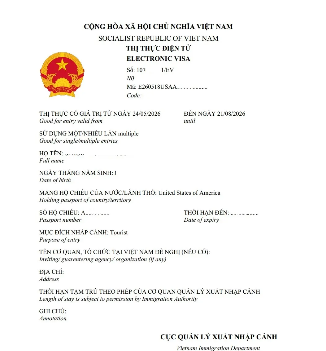 Vietnam visa for United States citizens: US passport next to Vietnam e-Visa approval document on a desk